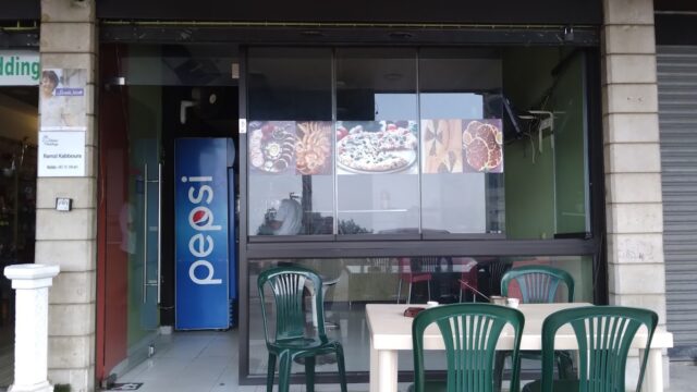 a restaurant with a table and chairs