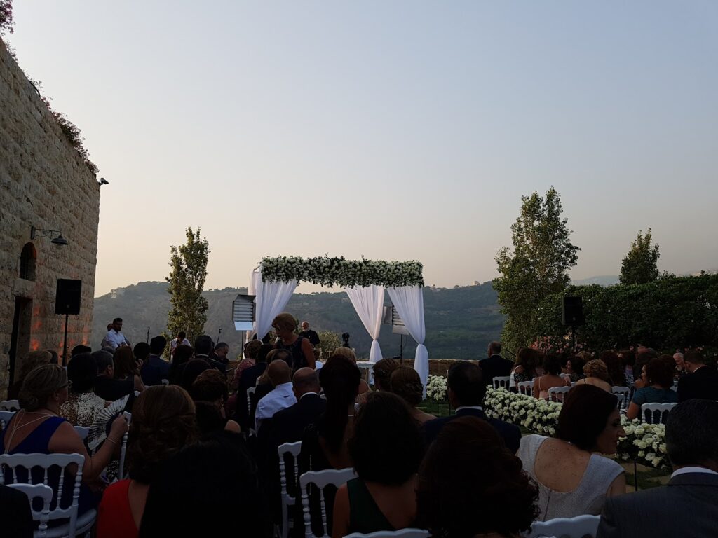 a group of people sitting in chairs outside