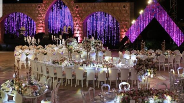 a large round table set for a wedding reception