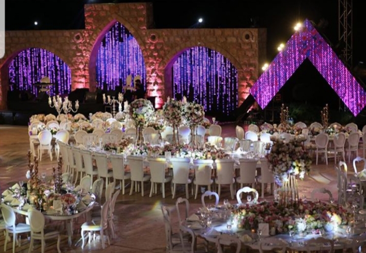 a large round table set for a wedding reception