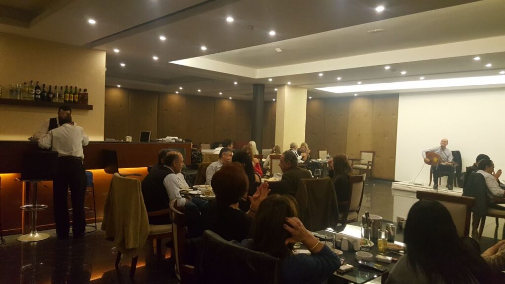 a group of people sitting at tables in a room