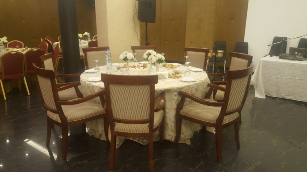 a round table with chairs around it