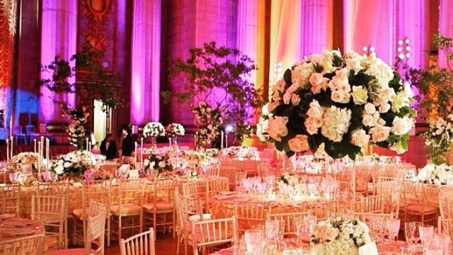 a large group of tables set up in a room