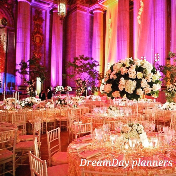 a large group of tables set up in a room