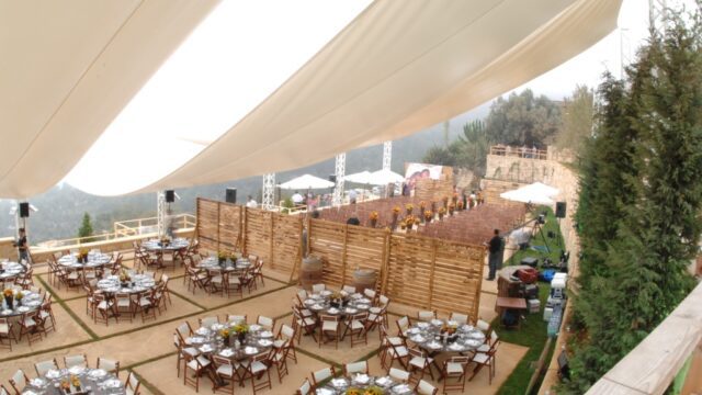 a large tent with tables and chairs