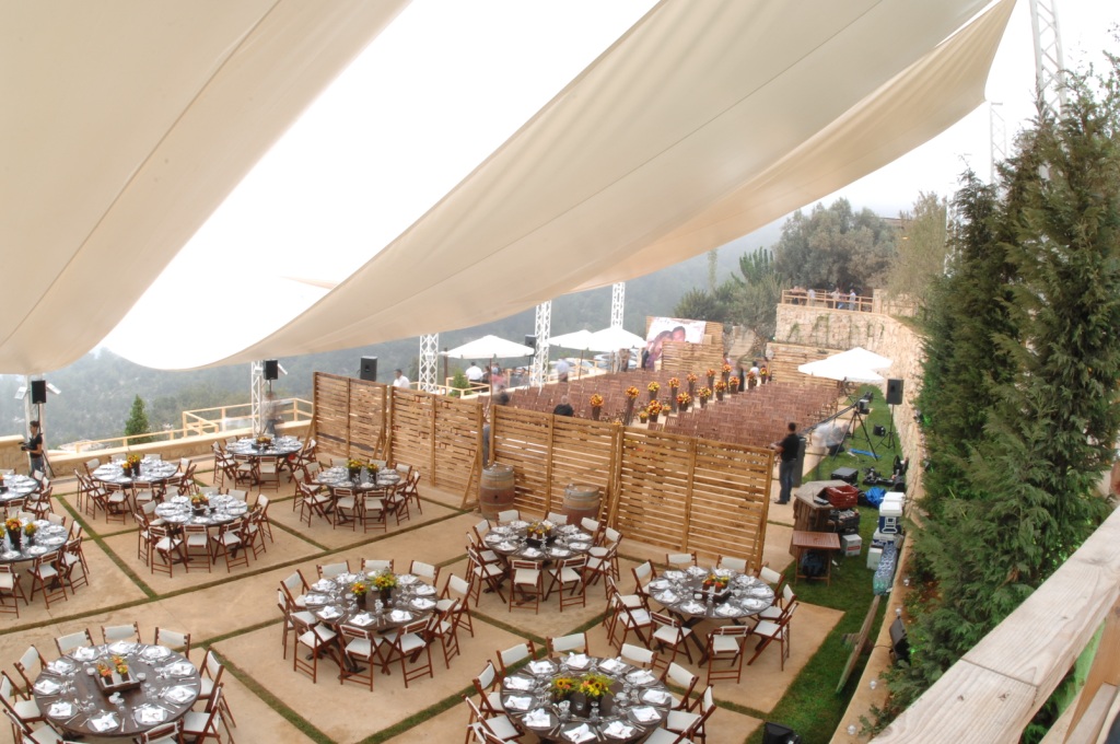 a large tent with tables and chairs