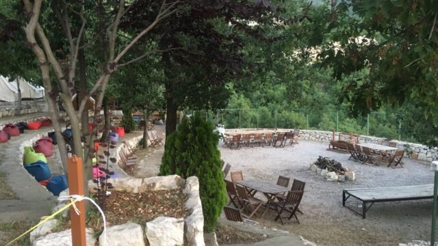 a group of tables and chairs outside