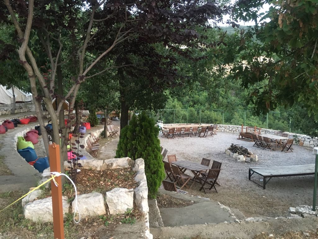 a group of tables and chairs outside