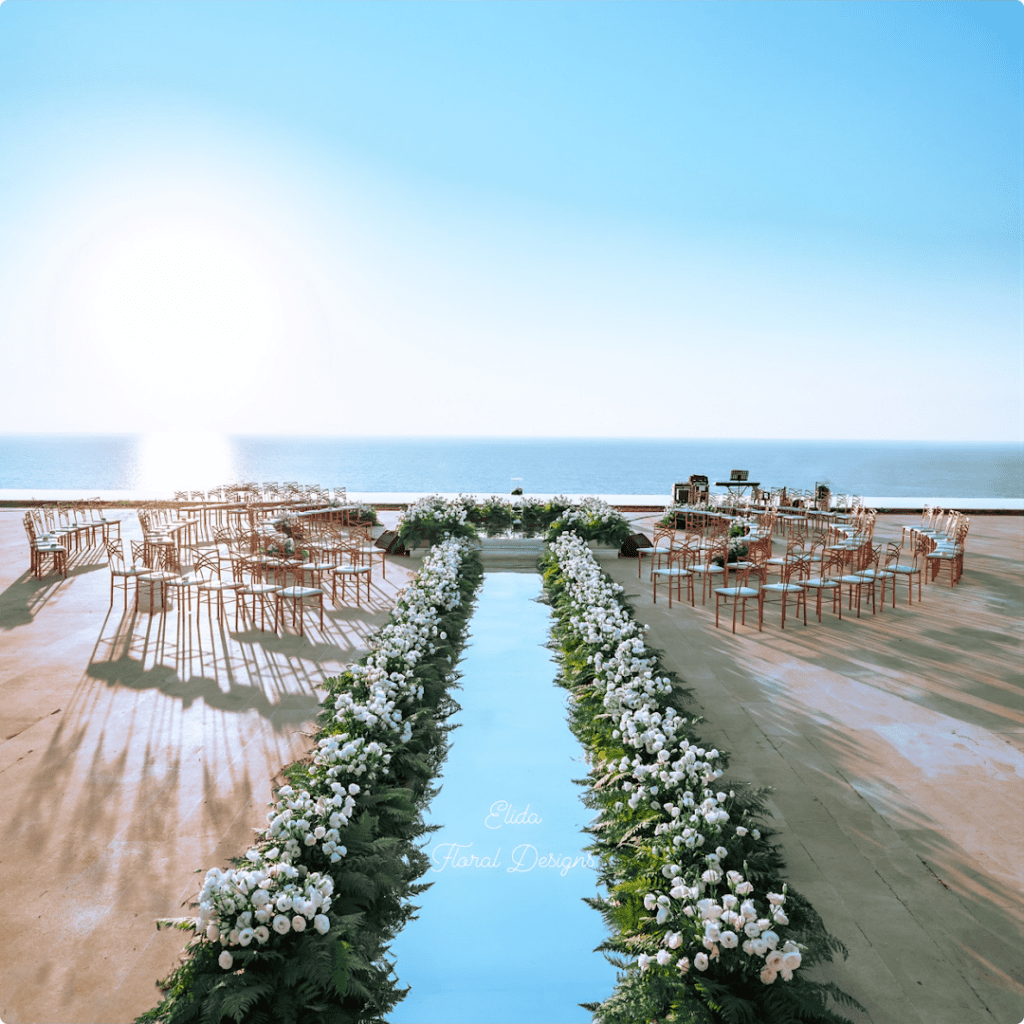 a wedding set up with chairs and tables and flowers