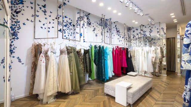 a room with dresses and butterflies on the wall