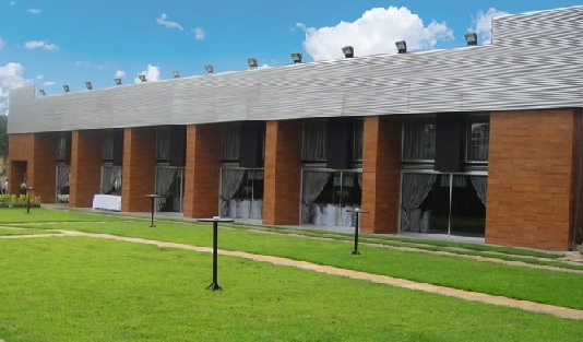 a building with a lawn and grass