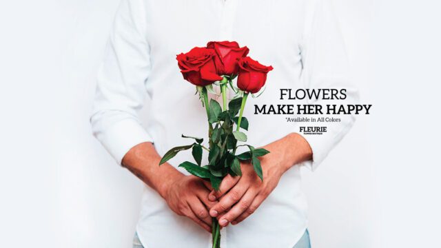 a man holding a bouquet of red roses