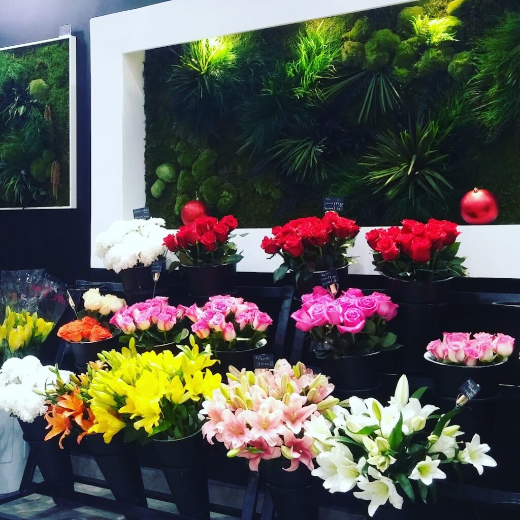 a group of flowers in a store