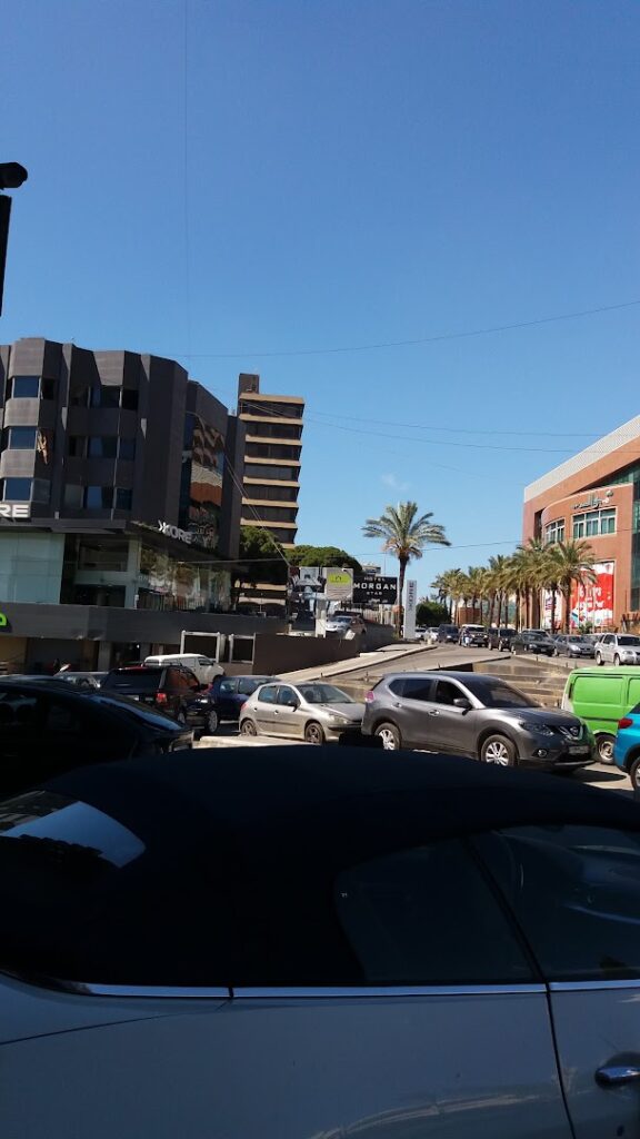 a street with cars and buildings