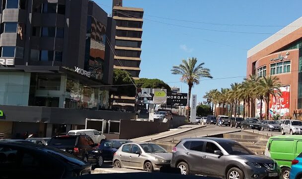 a street with cars and buildings