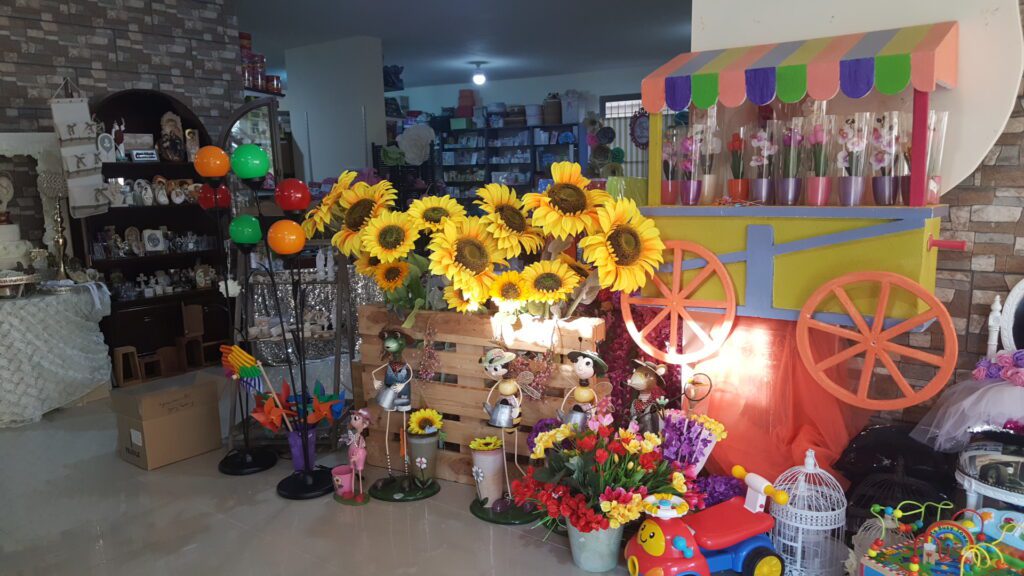 a display of flowers and toys in a store