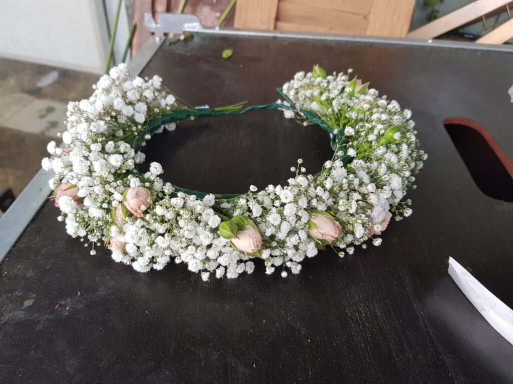 a wreath of flowers on a table