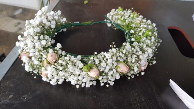 a wreath of flowers on a table