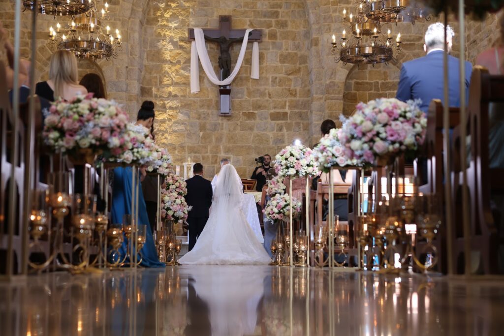 a bride and groom walking down a aisle