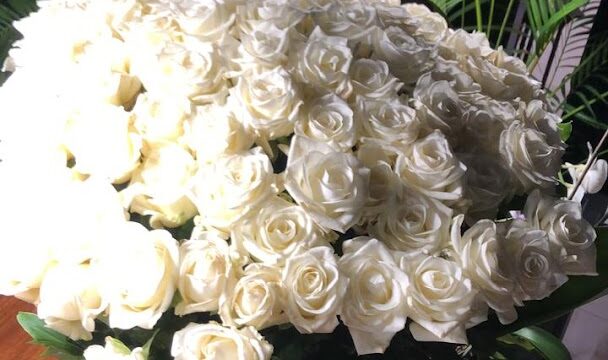 a large bouquet of white roses