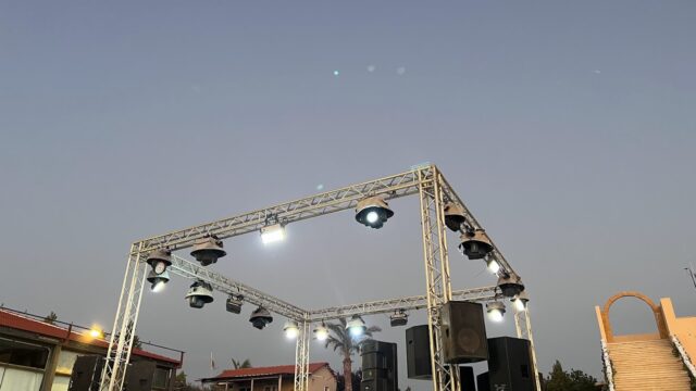 a stage with speakers and lights