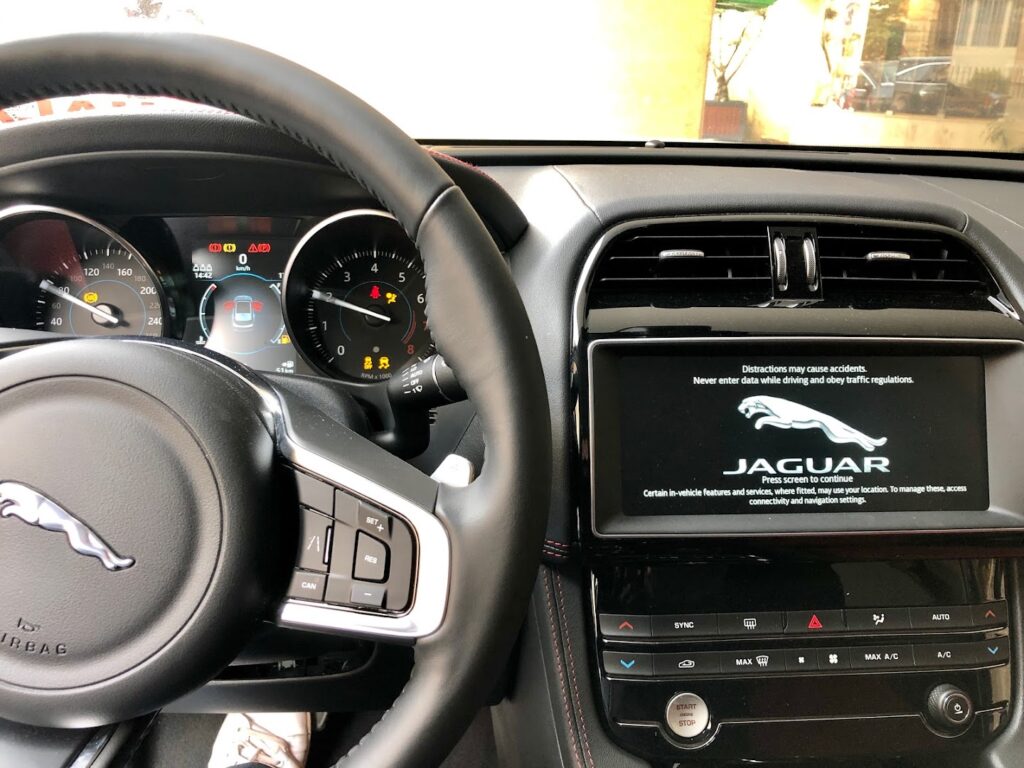 the steering wheel and dashboard of a car