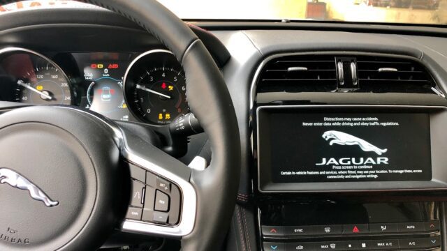 the steering wheel and dashboard of a car