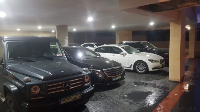 a group of cars parked in a parking garage