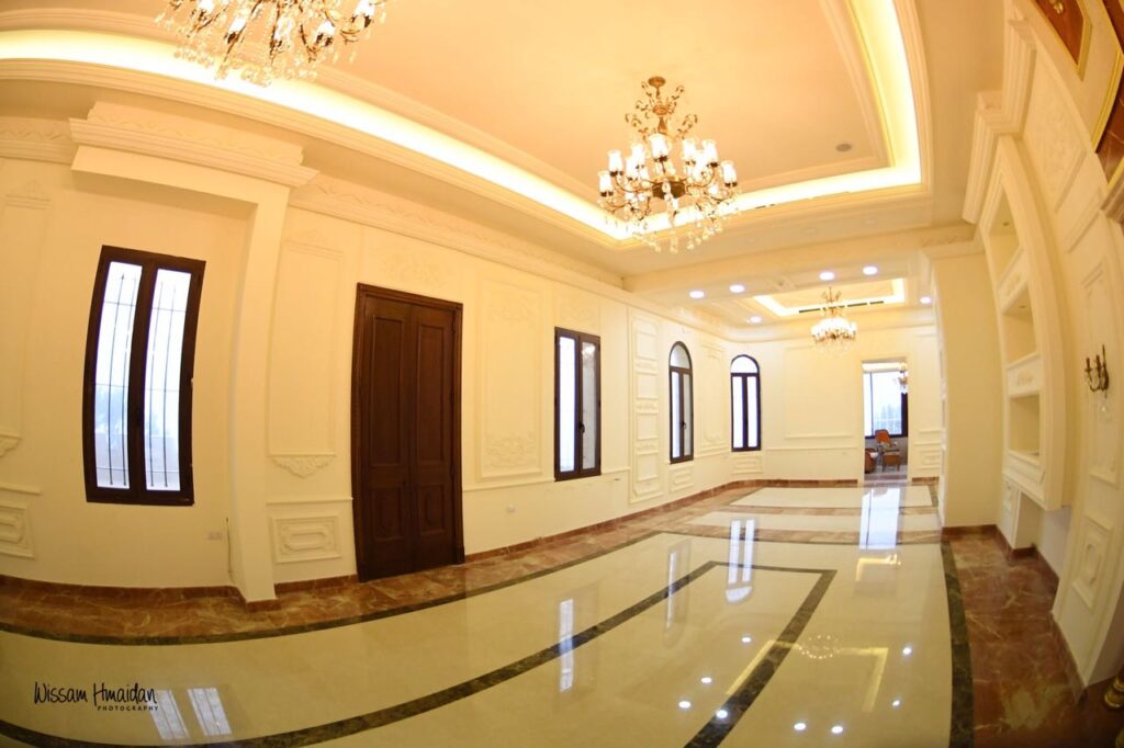 a room with chandeliers and marble floor