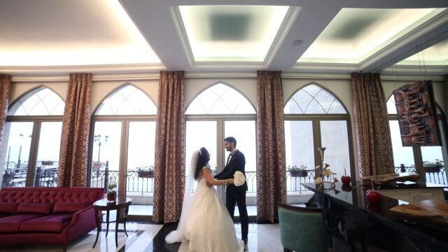 a man and woman in a room with windows