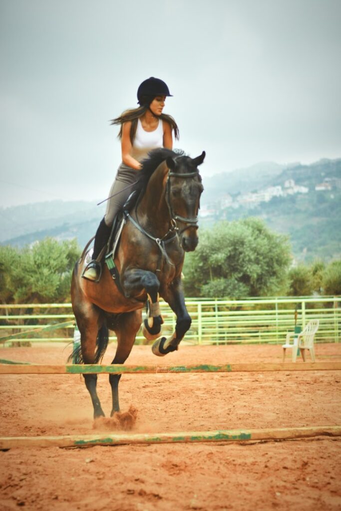 a woman riding a horse