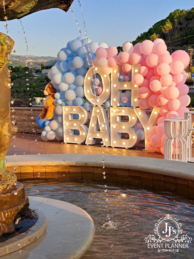 "JJ's Event Planner presents a balloon display with lights."