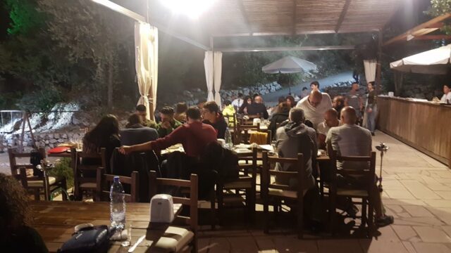 a group of people sitting at tables