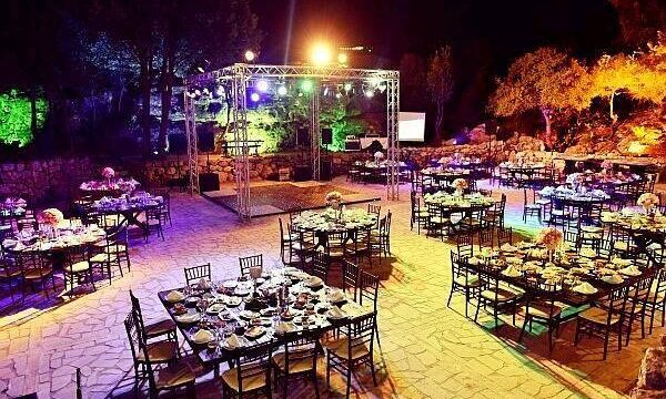 a outdoor event with tables and chairs