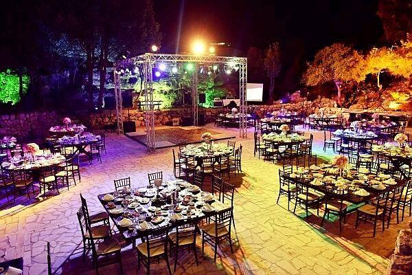 a outdoor event with tables and chairs