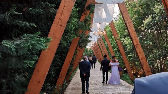 a group of people walking down a walkway