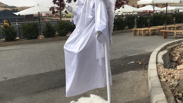 a statue of a man in a white robe