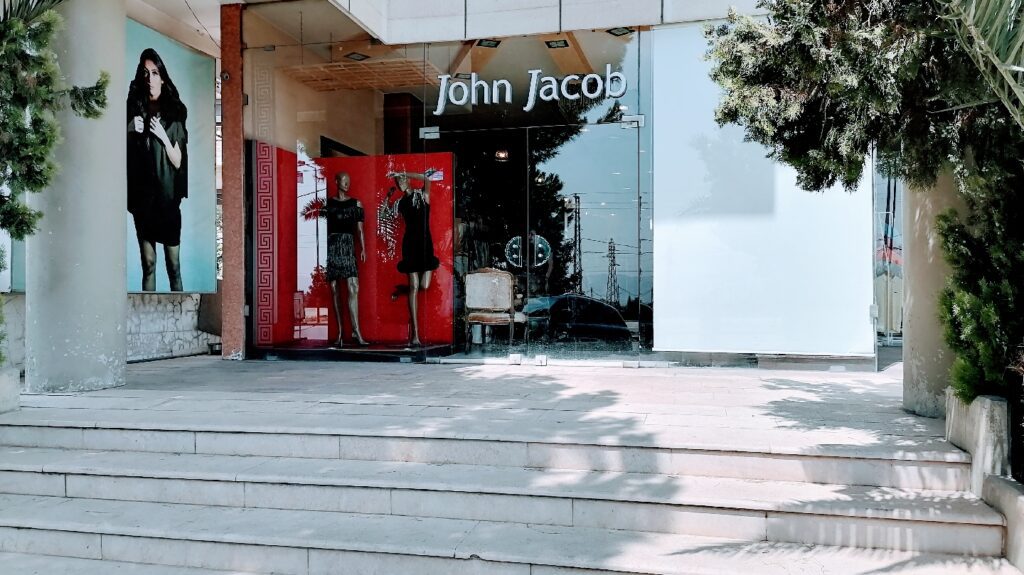 a store front with a red door and a red door