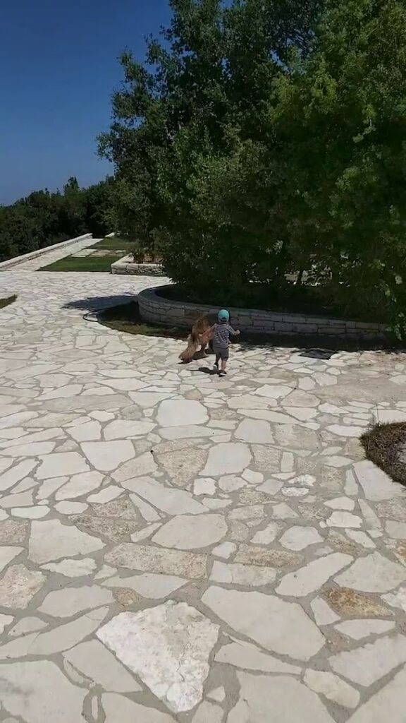 a child running on a stone path