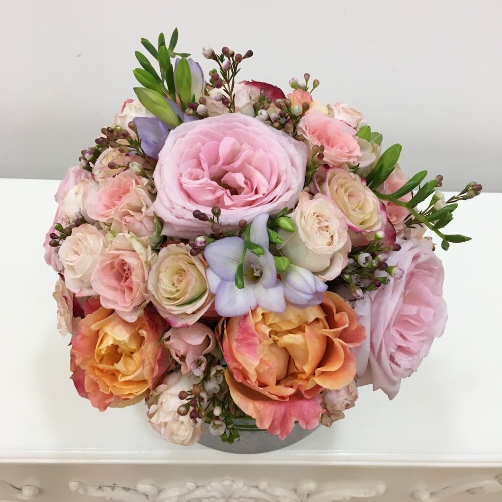a bouquet of flowers on a white surface