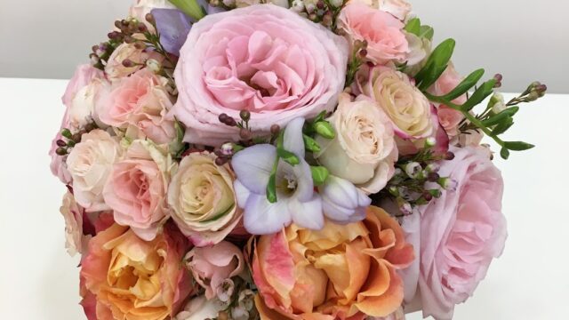 a bouquet of flowers on a white surface