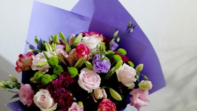 a person holding a bouquet of flowers