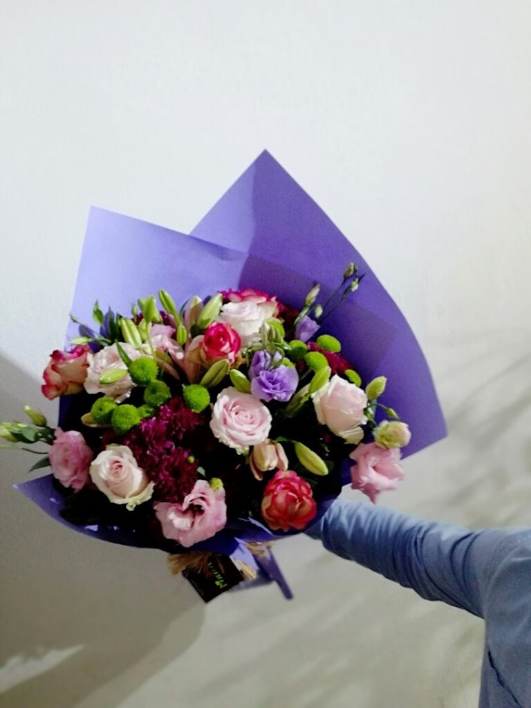 a person holding a bouquet of flowers