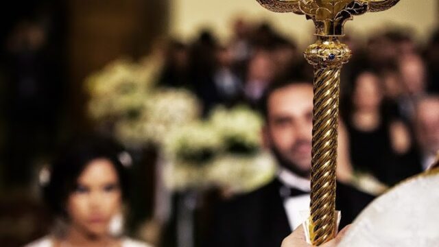 a man holding a gold object