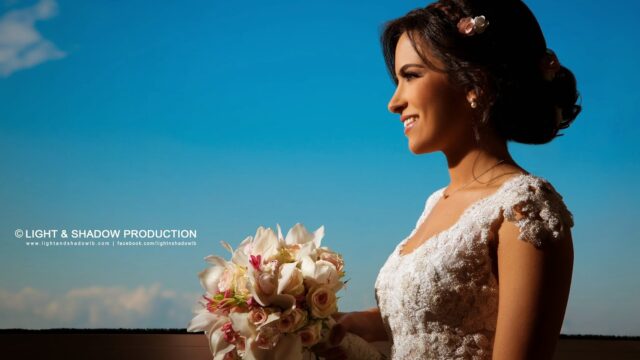 a woman in a wedding dress holding a bouquet