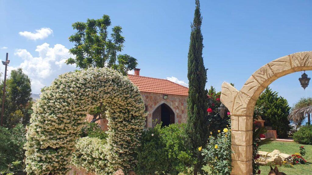 L'OR Wedding Venue is a house with a stone wall and a stone fence.