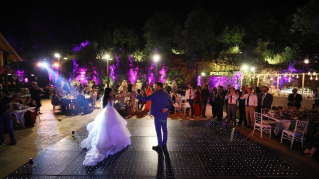 a man and woman dancing on a stage