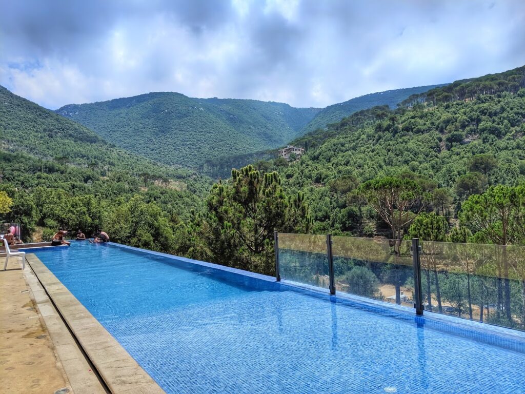 a pool with a view of the mountains