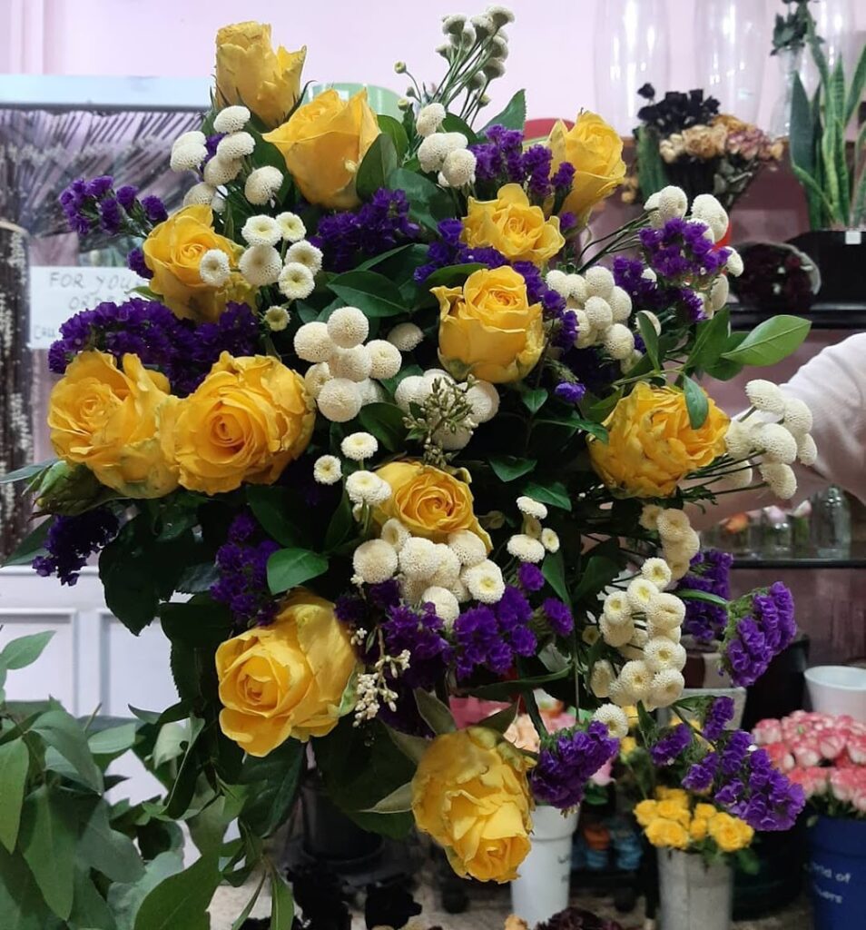 a bouquet of yellow and purple flowers