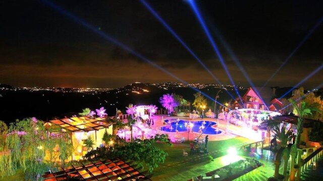 a pool with lights at night